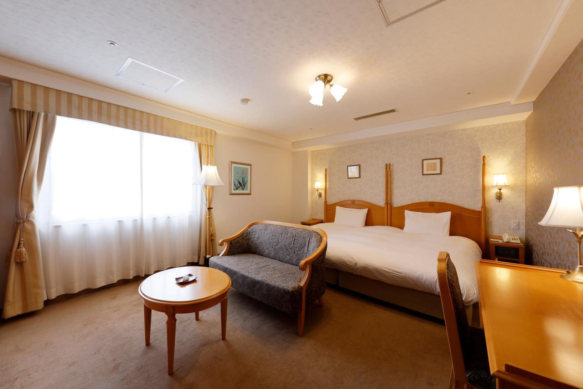 Kanazawa Hakuchoro Hotel Sanraku -Natural Hot Spring- Exterior foto A room at the hotel